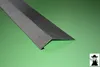A metal angle profile on a green surface. Produktbild-Vorschau