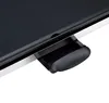 A close-up view of the corner of a black electric grill with a silver trim and a black pull-out drip tray. Produktbild-Vorschau