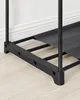 Close-up of the bottom corner of a black shoe rack, showing the frame and one of the fabric shelves. Produktbild-Vorschau