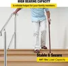 A person is using a handrail on a staircase. Produktbild-Vorschau