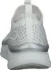 Rear view of a white sneaker with silver accents. Podgląd zdjęcia produktu