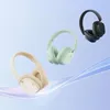 Three wireless headphones in different colors (white, light green, and black) are displayed against a light blue and white gradient background, with a flowing ribbon-like element at the bottom. Anteprima dell’immagine prodotto