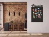 A kitchen with a brick wall, island, and stools, featuring a magnetic board with travel-themed magnets. Náhľad obrázku produktu
