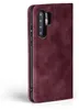 A close-up side view of a burgundy flip-style phone case for a Huawei P30. Produktbild-Vorschau