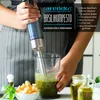 A person is using an immersion blender to make pesto, with ingredients shown nearby. Náhľad obrázku produktu