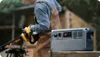 A person is using a chainsaw powered by a portable power station outdoors. Náhled obrázku produktu