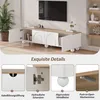 A TV stand with its doors open, showcasing its interior and details, with a television on top. Anteprima dell’immagine prodotto