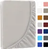 A close-up of a folded grey bedsheet with an elasticated edge, next to a grid of color swatches. Produktbild-Vorschau