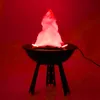 A simulated flame effect light is displayed on a black grill stand against a red background. Produktbild-Vorschau