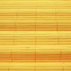 A close-up, full-frame shot of a yellow bamboo blind. Produktbild-Vorschau