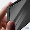A close-up shot of a person's fingers holding a smartphone with a screen protector applied. Náhľad obrázku produktu