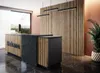 A reception desk with a wooden slatted wall behind it, in a modern office setting. Náhled obrázku produktu