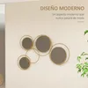 A modern metal wall mirror with multiple circular frames and reflective surfaces, mounted on a light-colored wall, with a plant in the foreground. Produktbild-Vorschau