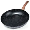 A black frying pan with a speckled pattern and a wooden handle is shown against a white background. Anteprima dell’immagine prodotto