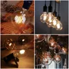 A collage of four images showcasing various vintage-style LED light bulbs in different settings. Produktbild-Vorschau