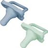 Two pacifiers, one blue and one green, are shown against a white background. Produktbild-Vorschau