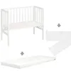 A white crib with a mattress and a mesh barrier, presented on a white background. Produktbild-Vorschau