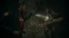 A woman in an FBI jacket shines a flashlight on a creature in a dark, wet environment. Podgląd zdjęcia produktu