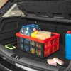 The image shows the interior of a car trunk with a foldable storage box filled with water bottles, cleaning supplies, and other items. Produktbild-Vorschau