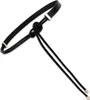 A black leather belt with a knot detail and gold-colored hardware, presented on a white background. Náhled obrázku produktu