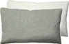 Two pillows are shown, one in front of the other. The front pillow is gray, and the back pillow is white. Produktbild-Vorschau