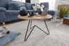 A coffee table with decorative items in a living room setting. Náhled obrázku produktu