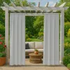 Outdoor curtains hanging on a pergola over a patio with furniture. Podgląd zdjęcia produktu
