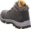 A side view of a single charcoal-colored Skechers winter boot with yellow accents. Voir les images du produit