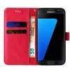 A red flip cover case for a Samsung Galaxy S7 edge phone, with a 50 Euro banknote inserted. Produktbild-Vorschau