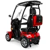 A red three-wheeled mobility scooter with a roof and a rear storage box, shown from a three-quarter rear angle against a white background. Produktbild-Vorschau