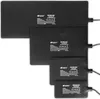 Four black heating mats of different sizes are arranged diagonally on a white background. Anteprima dell’immagine prodotto