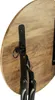 A close-up view of the underside of a wooden stool, showing its folding mechanism. Produktbild-Vorschau
