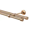 A close-up, angled view of a double curtain rod with a bronze finish, set against a white background. Anteprima dell’immagine prodotto