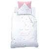 A white duvet cover and pillowcase set with a pink and white unicorn-like design, featuring closed eyes and stars. Produktbild-Vorschau
