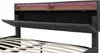 Close-up of the headboard of a bed, showing storage compartments and LED lighting. Produktbild-Vorschau