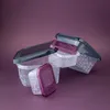 A collection of clear plastic food storage containers with purple and gray lids, arranged on a purple background. Náhľad obrázku produktu