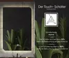 A split image showing a backlit mirror on the left and marketing text with a logo and plants on the right. Produktbild-Vorschau