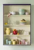 A display cabinet filled with various kitchenware items. Produktbild-Vorschau