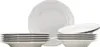 A set of white ceramic plates and bowls stacked against a white background. Produktbild-Vorschau