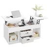 A white lift-top coffee table with storage compartments and drawers, displaying various items like a laptop, headphones, books, and decorative balls. Náhled obrázku produktu