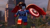 A LEGO minifigure of Falcon, dressed as Captain America, flying in front of a city skyline. Podgląd zdjęcia produktu