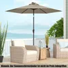 An outdoor patio scene with furniture and a large umbrella. Náhled obrázku produktu
