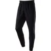 A pair of black jogger pants shown from the front against a white background. Produktbild-Vorschau