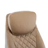 Close-up of a tan leather office chair headrest and upper back. Produktbild-Vorschau