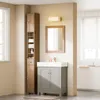 A bathroom vanity and tall cabinet are shown in a well-lit room. Náhled obrázku produktu