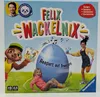 The image shows the box of a board game called 'Felix Wackelnix' by Ravensburger. It features cartoon characters and children playing, with text describing the game's benefits. Produktbild-Vorschau