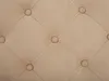 A close-up view of a tufted fabric surface with diamond-shaped stitching and buttons. Náhled obrázku produktu