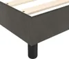 A close-up view of the corner of a dark gray upholstered bed frame with wooden slats visible inside. Náhled obrázku produktu