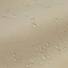 Close-up of a beige fabric with water droplets on it. Anteprima dell’immagine prodotto