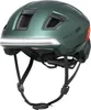 A green bicycle helmet with integrated lights. Náhled obrázku produktu